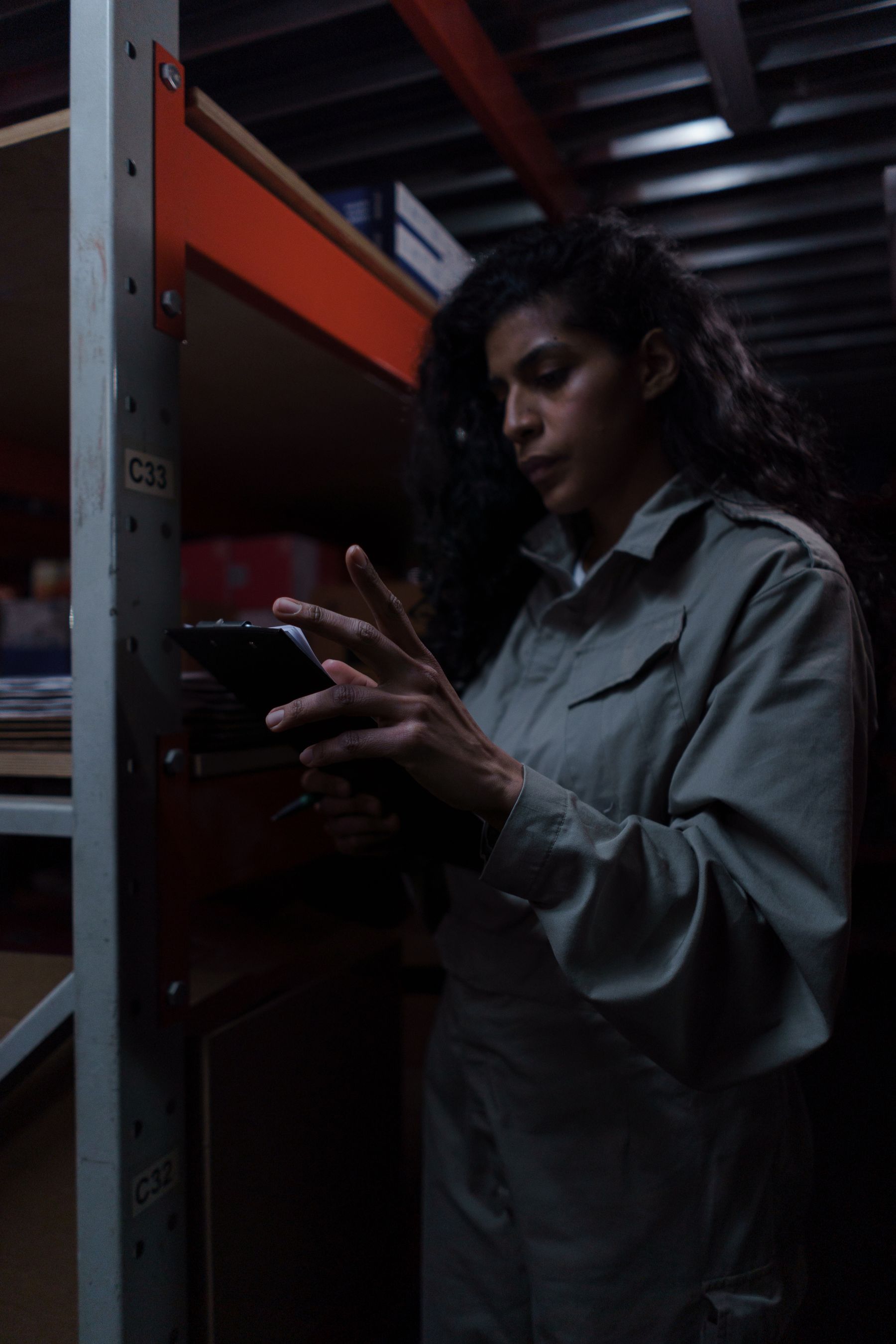 Operations professional reviewing launch inventory in a warehouse