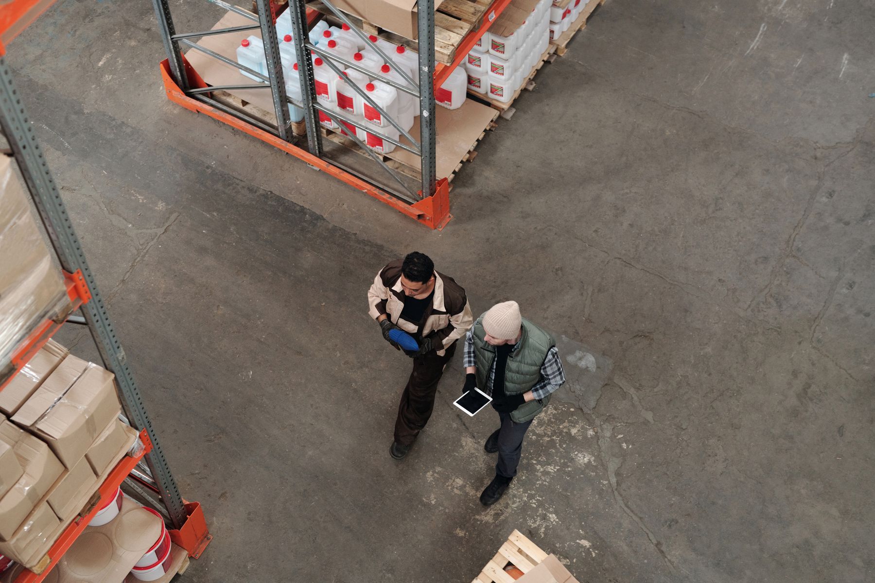Operations professionals coordinating a supply program in a distribution facility