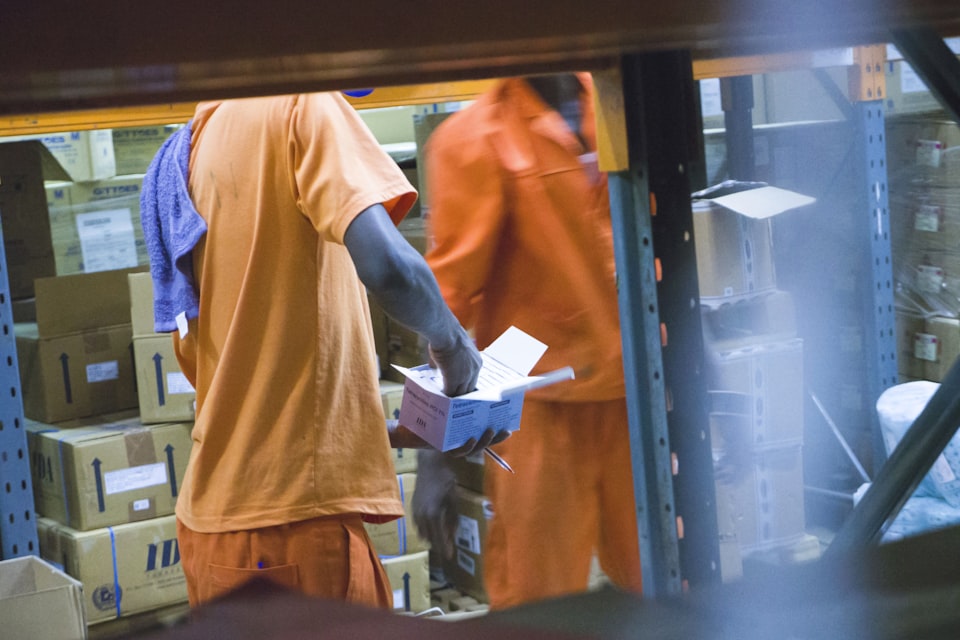 Receiving team handling identified cartons through a controlled handoff