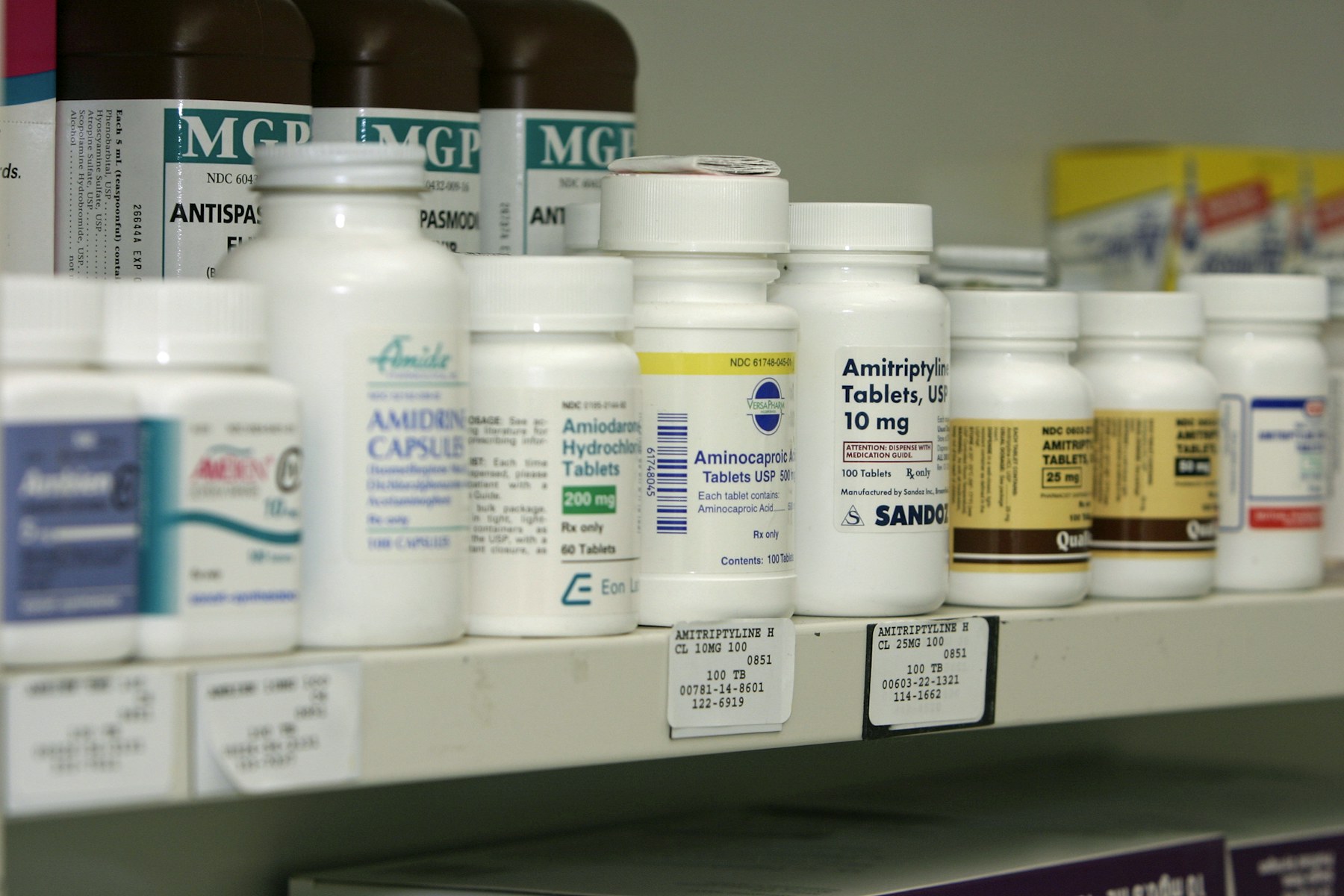 Organized pharmacy inventory arranged across rows of shelving