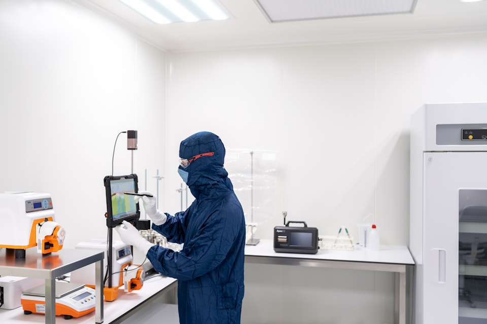 Laboratory specialist reviewing a controlled research process