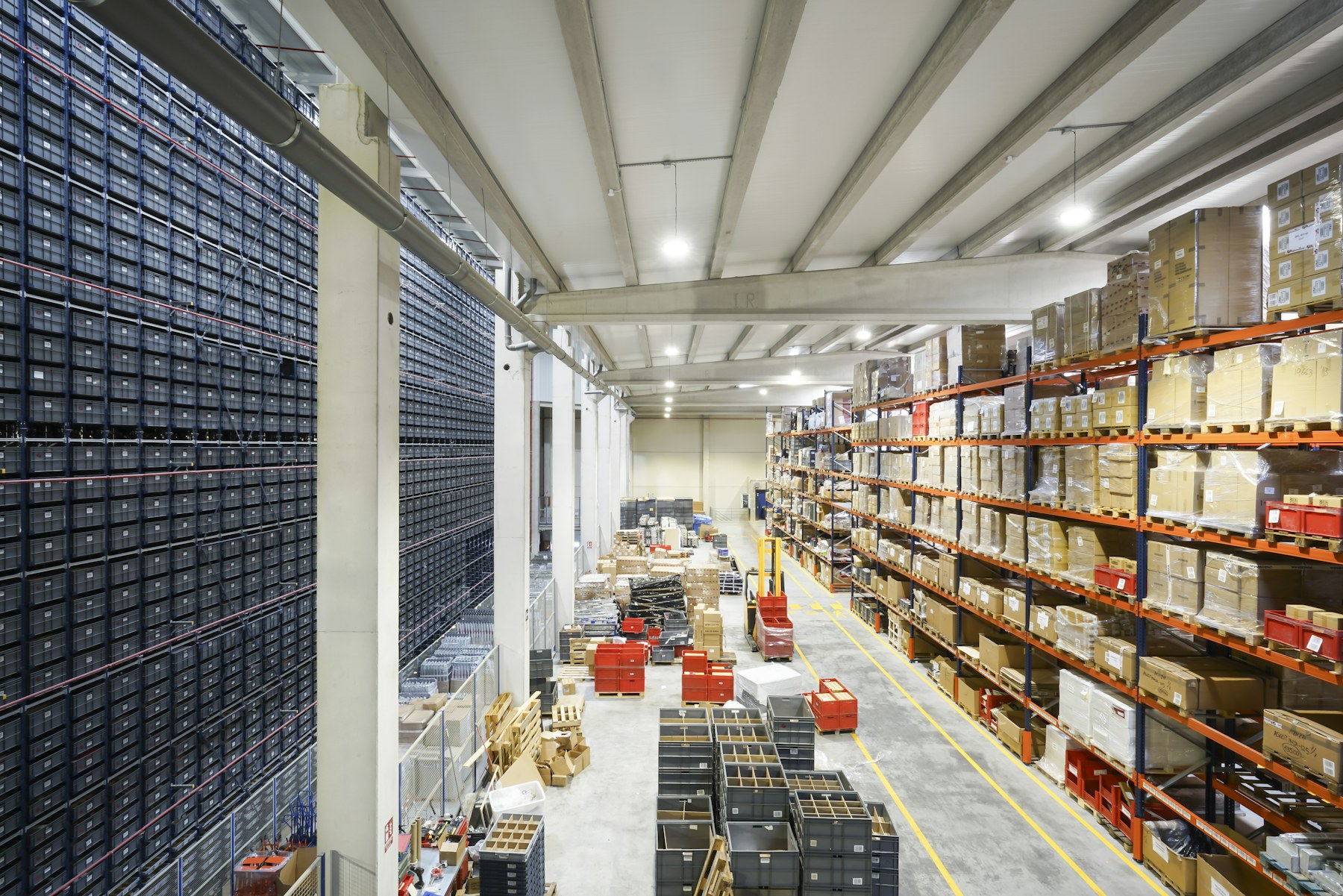 Organized distribution center with inventory stored on tall shelving